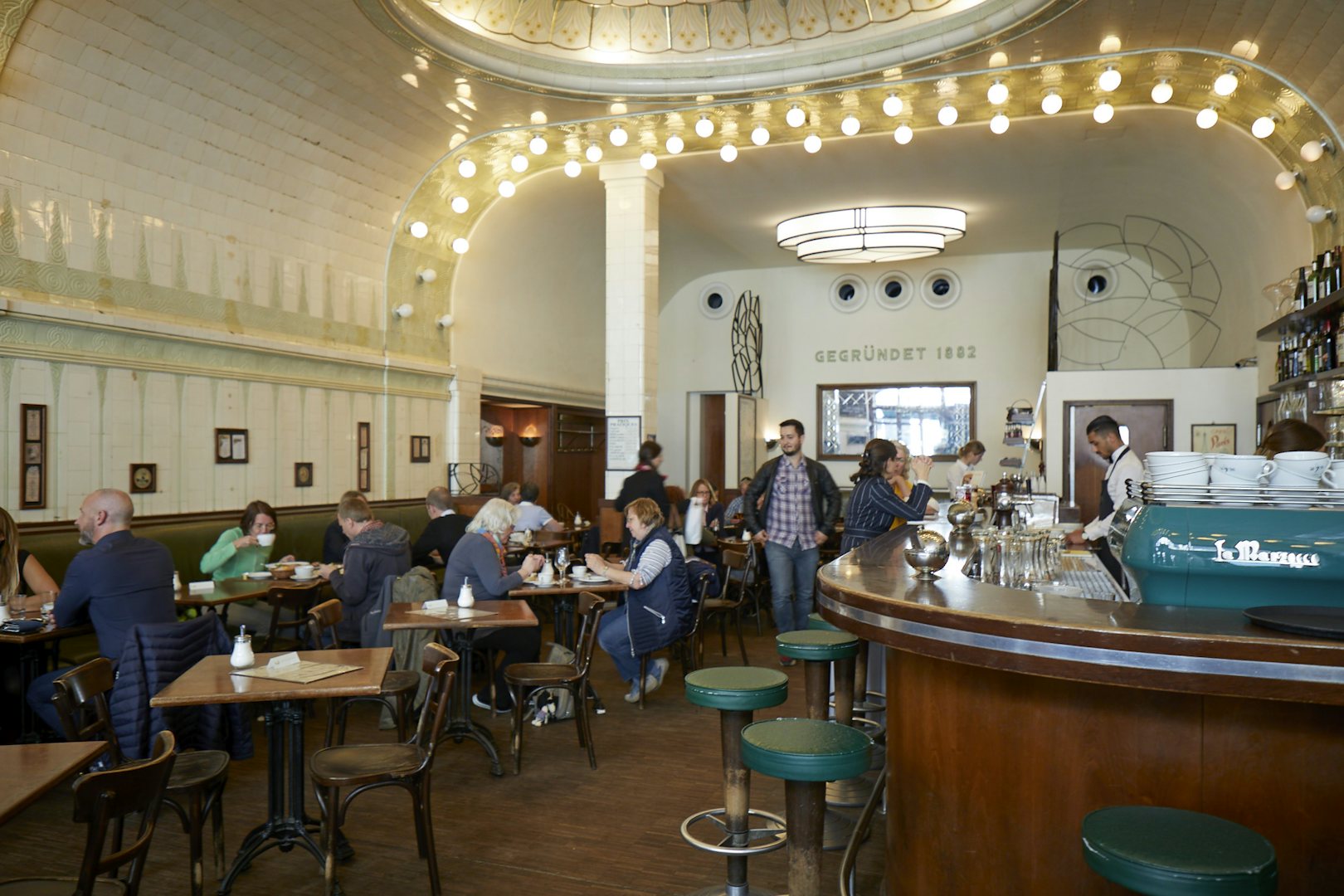 bar interior and people having drinks at Cafe Paris Hamburg