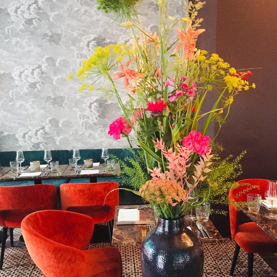 colourful interior of Witwenball and a big pot of flowers