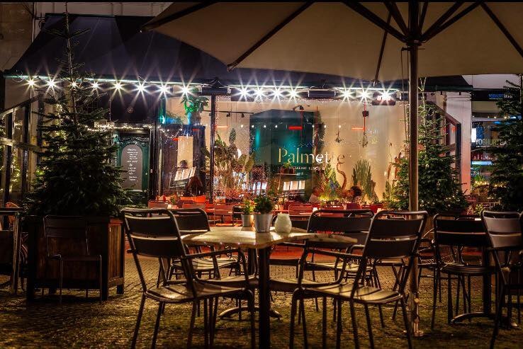 terrace of Palmette restaurant during the night in The Hague