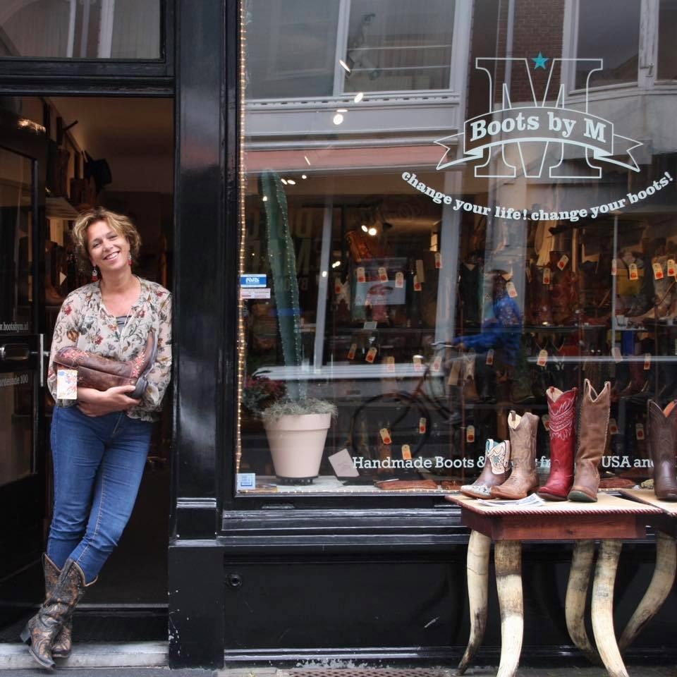 owner and street front of Boots by M store in The Hague