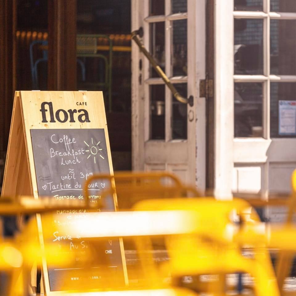 terrace and street sign of Cafe Flora Brussels