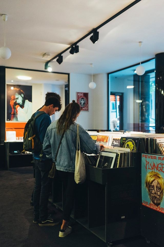 man and woman in record store Chez Pias in Brussels