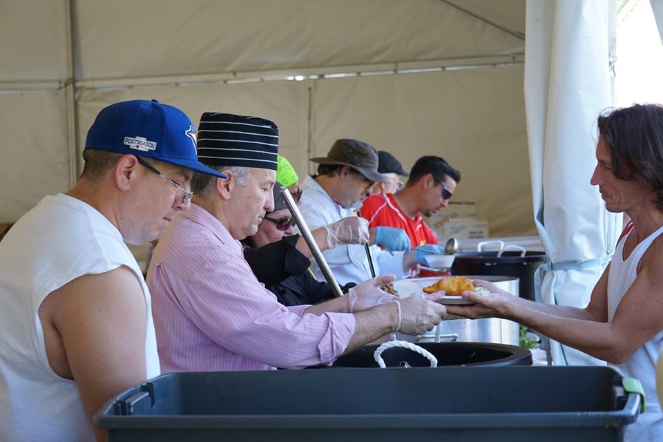 people serving food at the Na-Me-Res Pow Wow