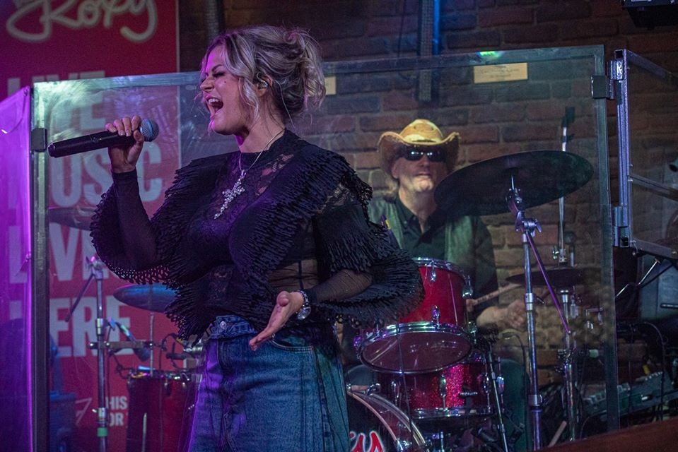 woman performing a concert at the Roxy Cabaret