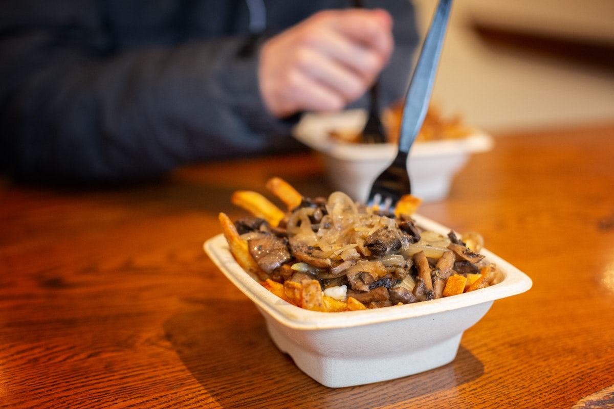 a plate of Poutine from Poutini's Toronto