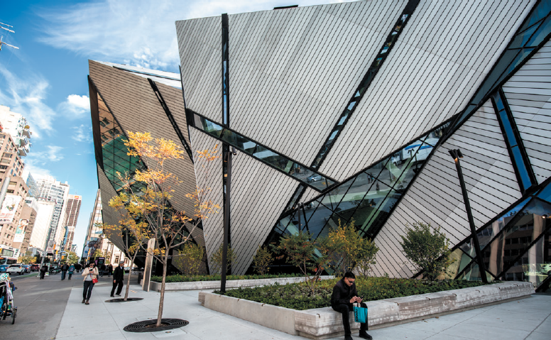 man sitting outside of the Royal Ontario Museum