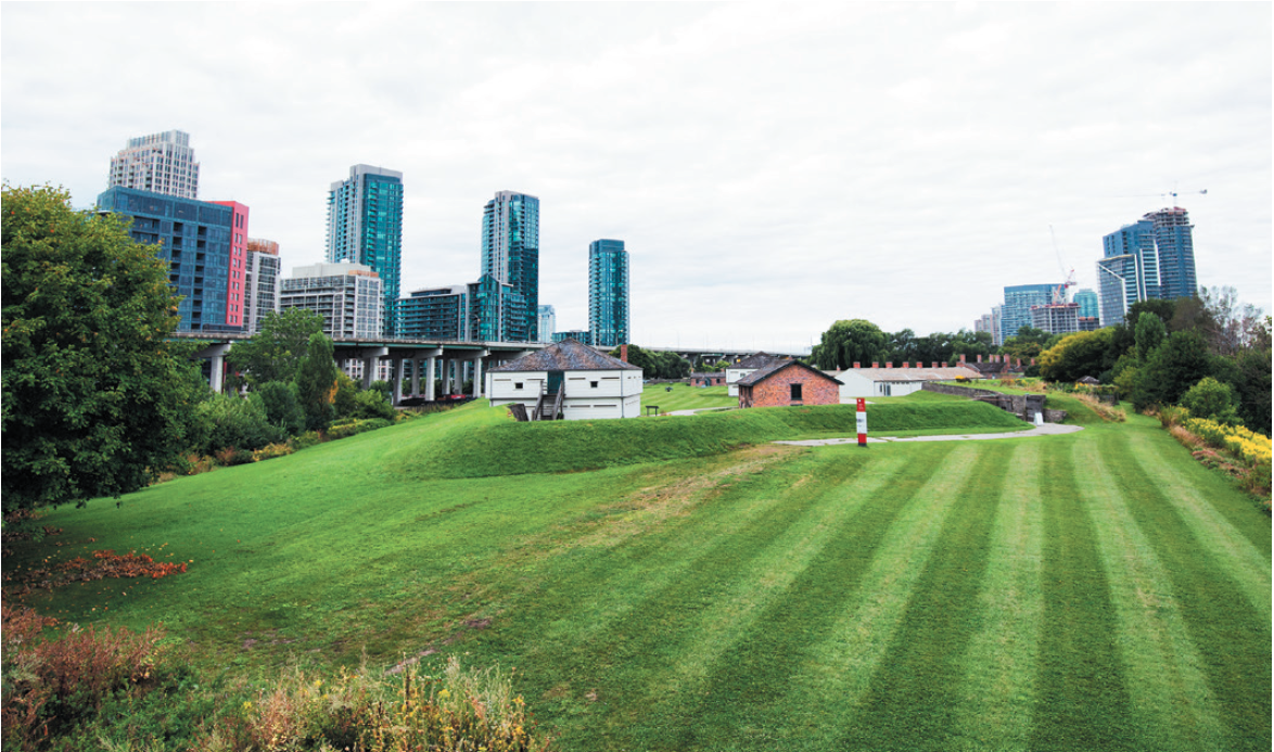 lawn of the Fort York against skyscrapers in Toronto