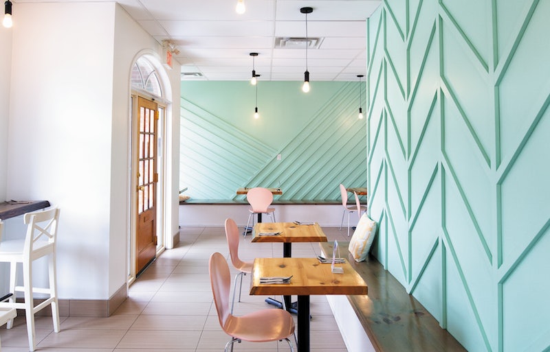 neon pink and blue interior of Bliss Kitchen Toronto