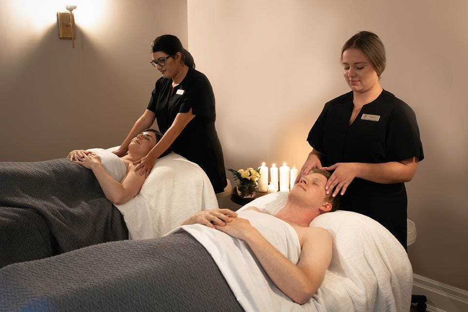 a couple getting a massage at the Inn On The Twenty