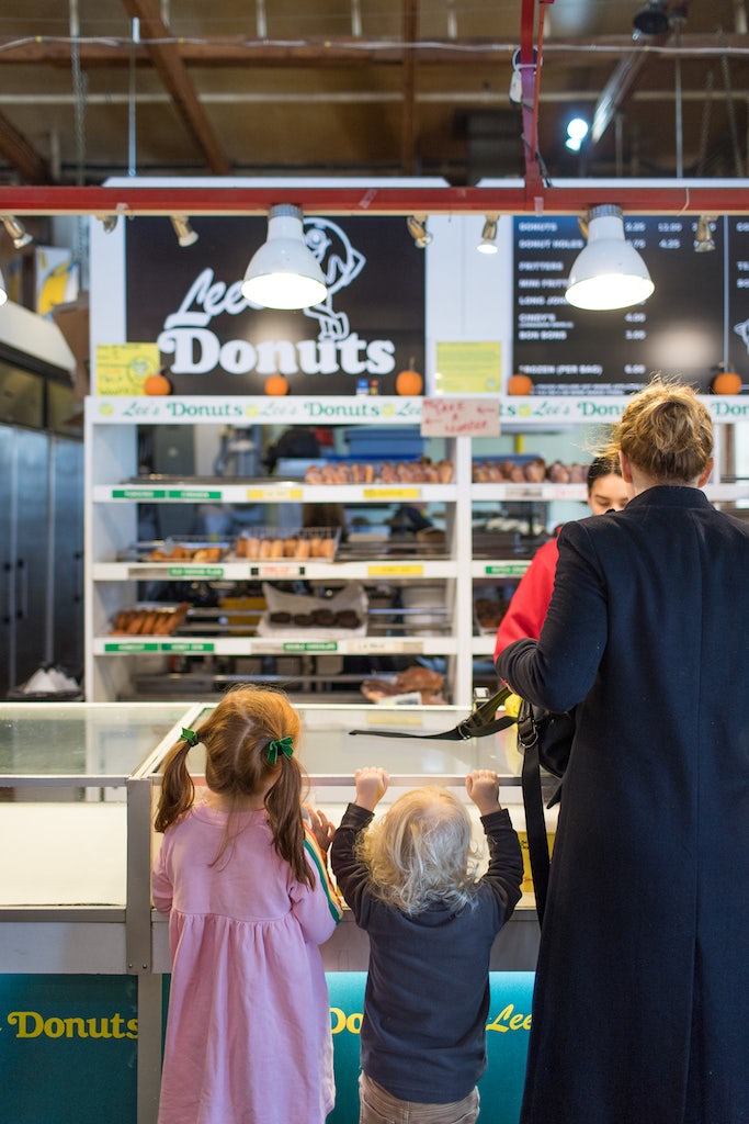 kids and mother ordering donut at Lees Donuts in Granville Island Market