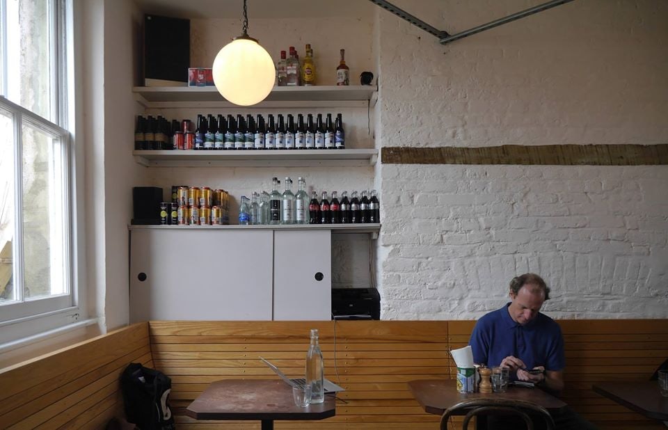 a man enjoying a tea at Good & Proper Tea London