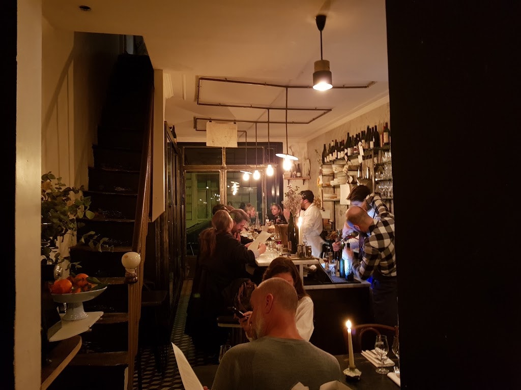people having a drink at wine bar Vivant Paris