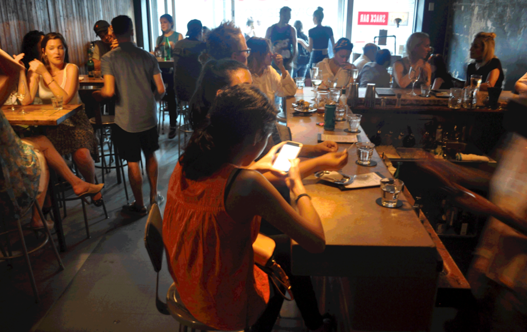 people enjoying a drink at snackbar 416 Toronto