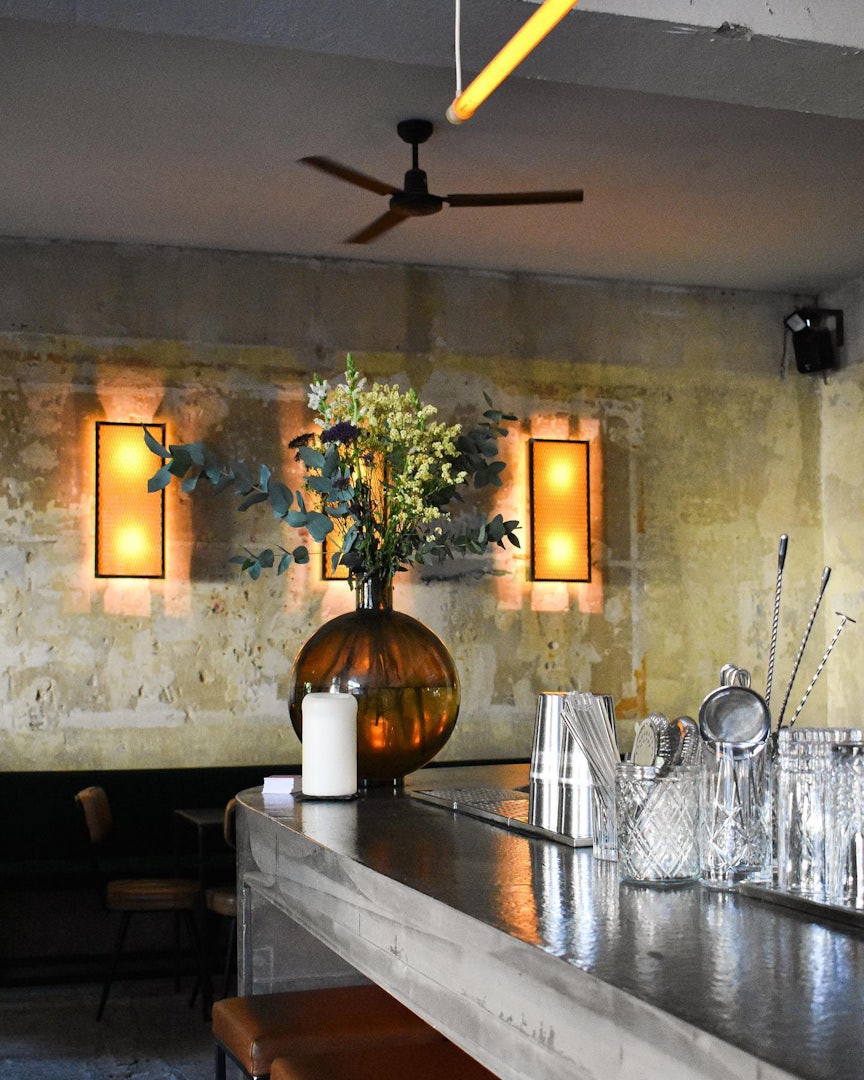 Berlin - Lamm bar concrete counter with glasses and vase