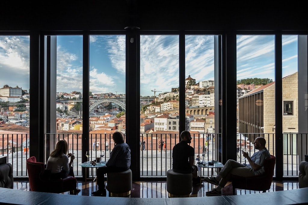 people having a drink at the Angel's Share Wine Bar with a beautiful view over Porto
