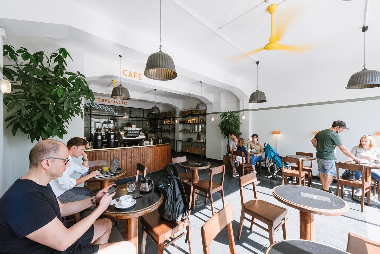 young people co-working inside of Combi coffee bar in Porto