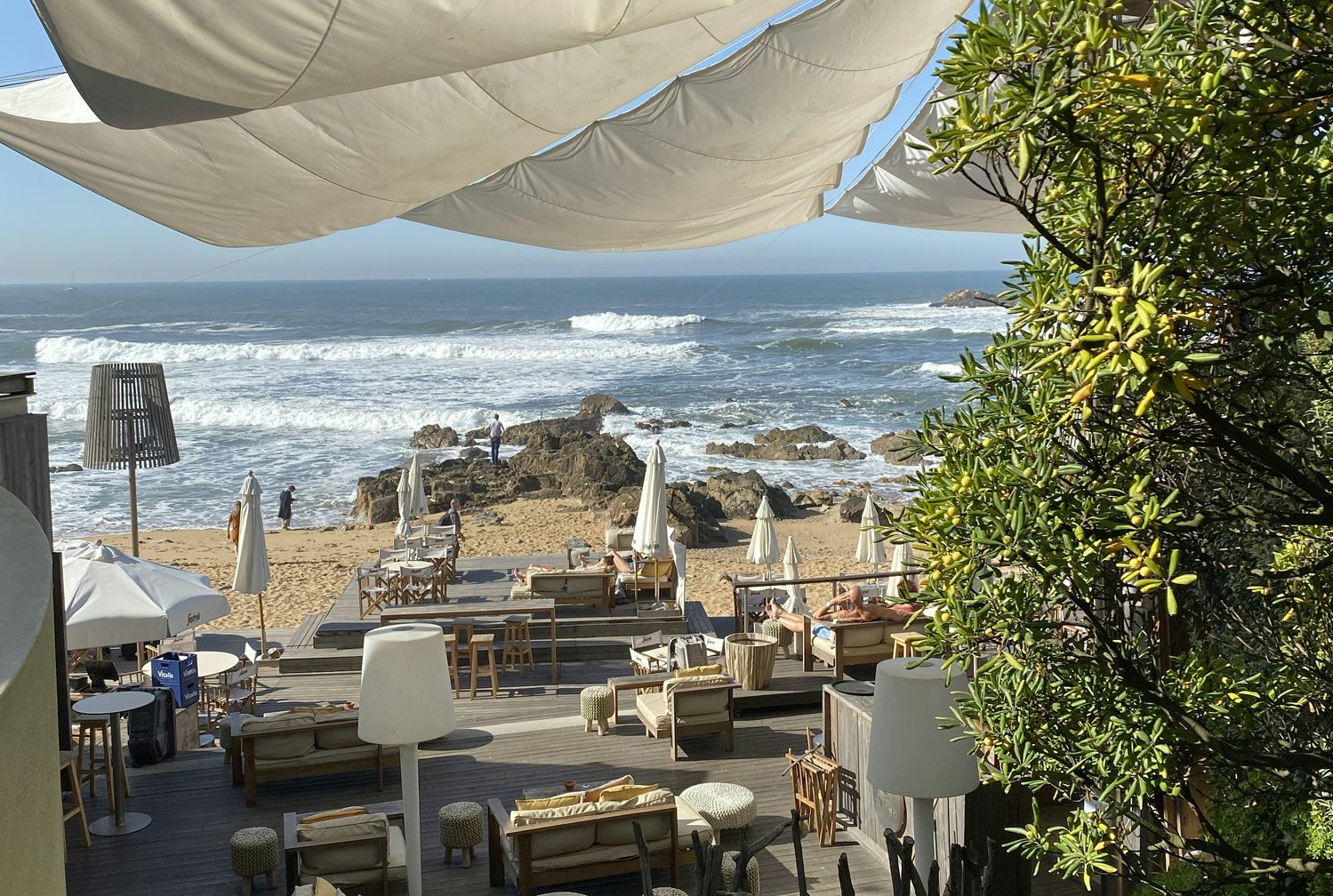 outdoor seating area with sea view at Praia Da Luz bar in Porto