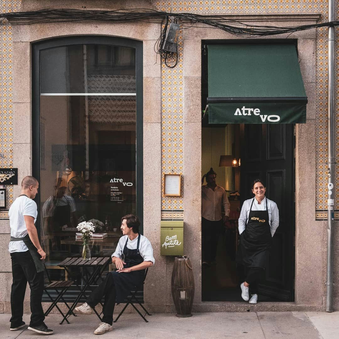 staff of Atrevo restaurant standing in front of the restaurant facade 