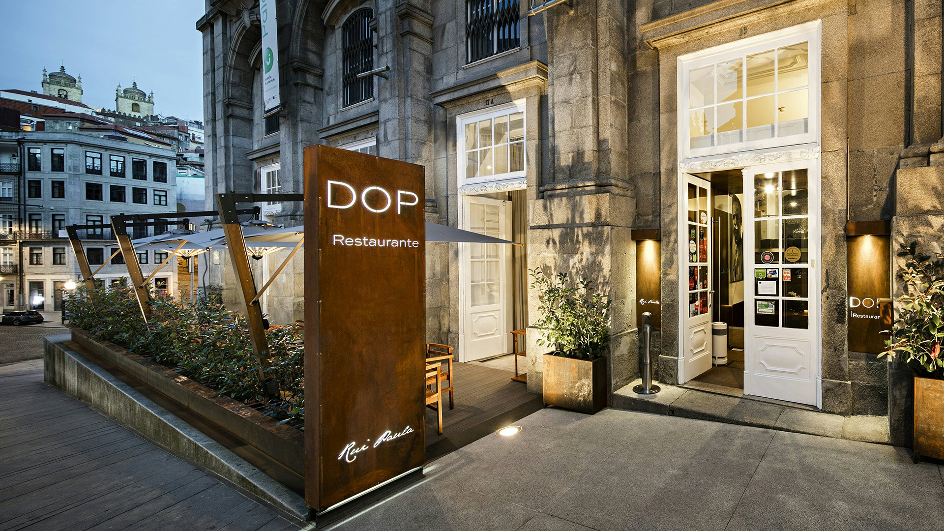 streetview of sign and the entrance to DOP restaurante in Porto