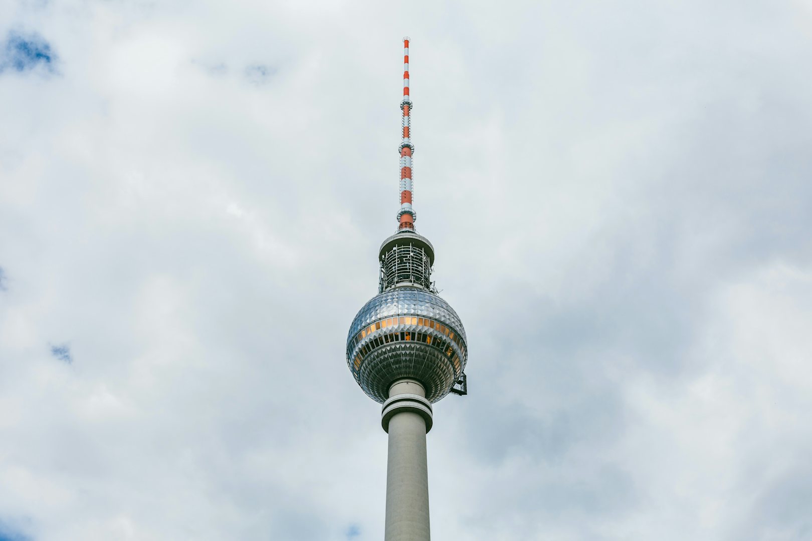 berlin fernsehturm against a blue cloudy sky