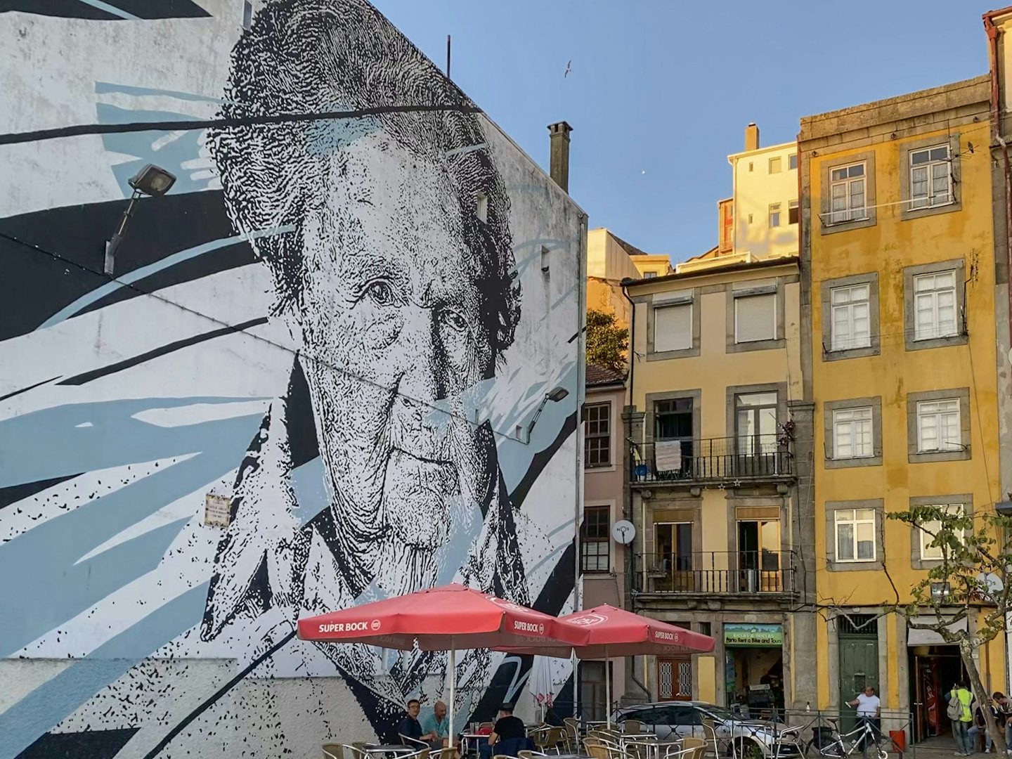 a big mural called Mira made by Daniel Eime in Porto