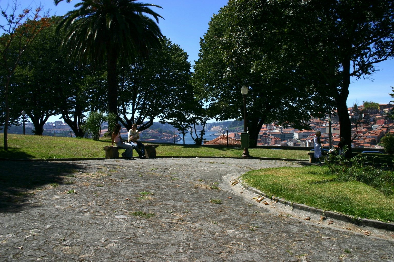 a couple sitting in the Jardim do Morro in Porto