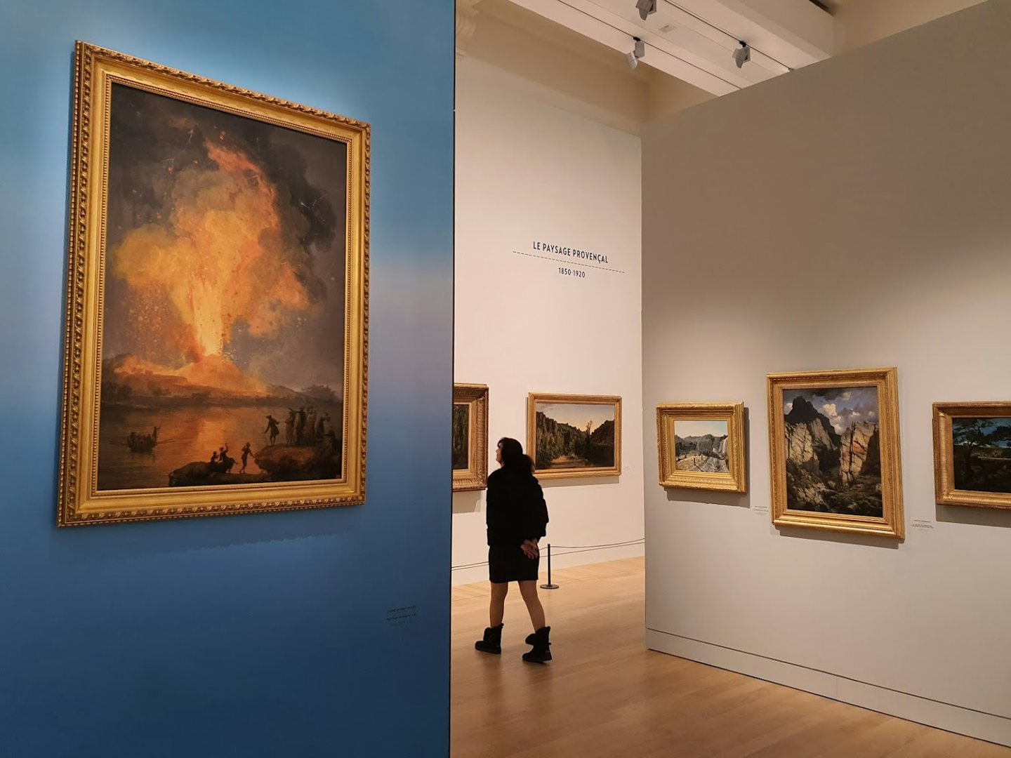 a woman walking around in the Musée d'Art de Toulon