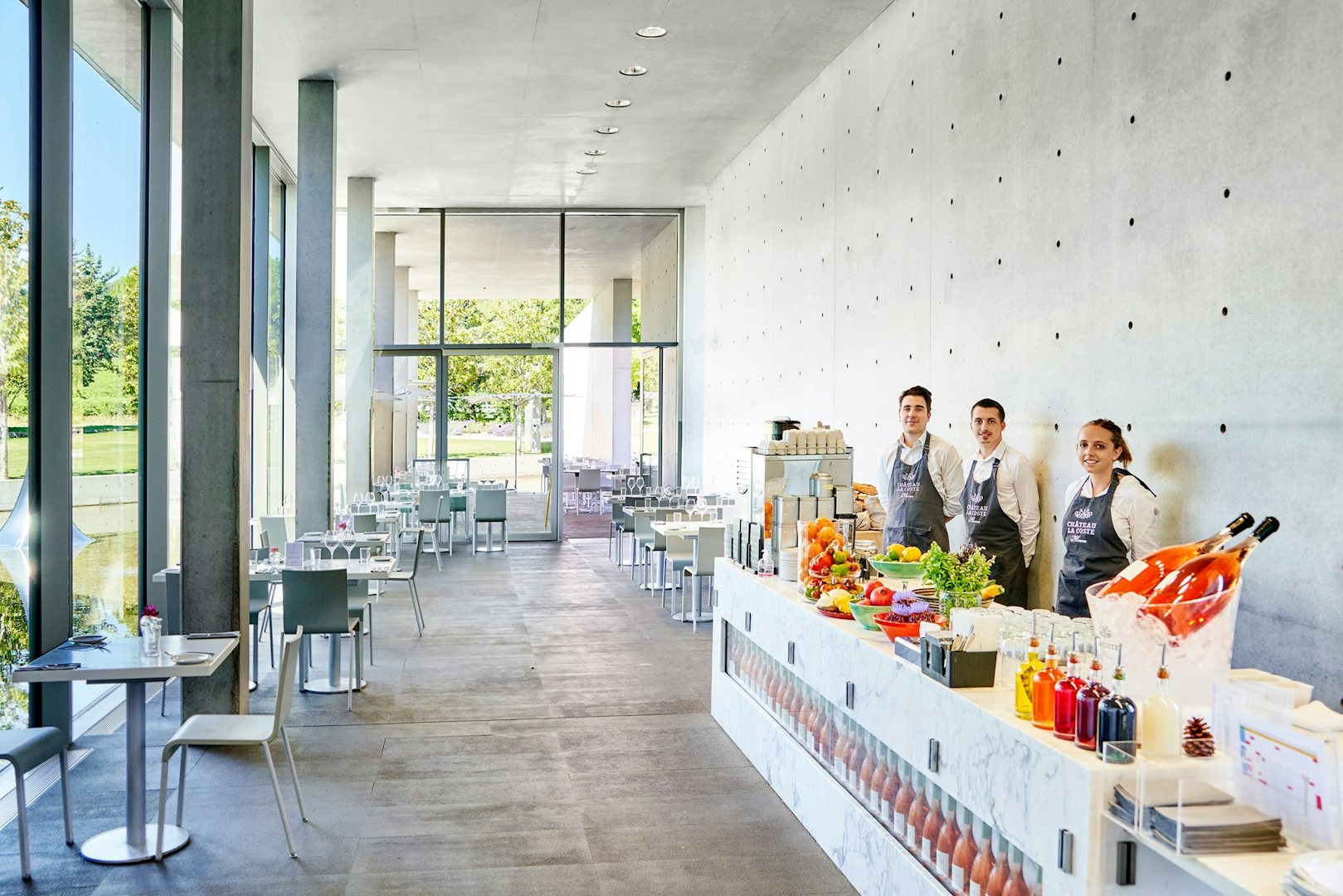 minimalist restaurant interior and the staff at the Château La Coste