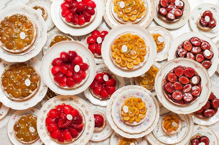 a flatlay shot of different types of fruit cakes made by Parisien patisserie Bontemps