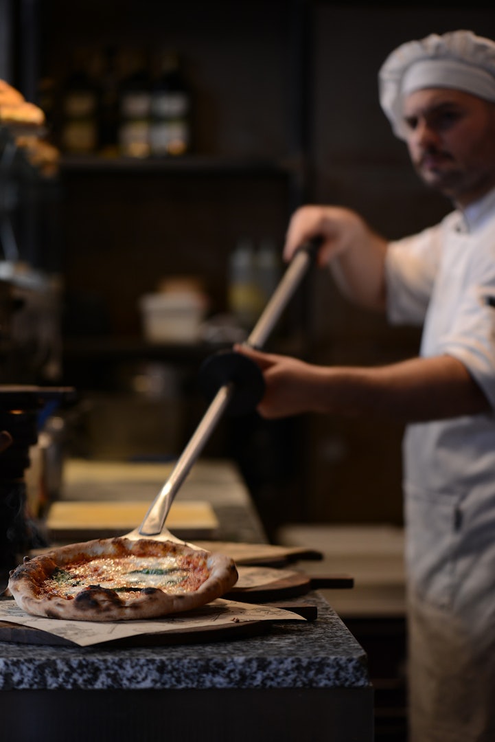 baking fresh oven pizza at Baracca restaurant in Leuven