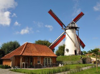 Café René inside of an old country-stile cottage and windmill in Belgium