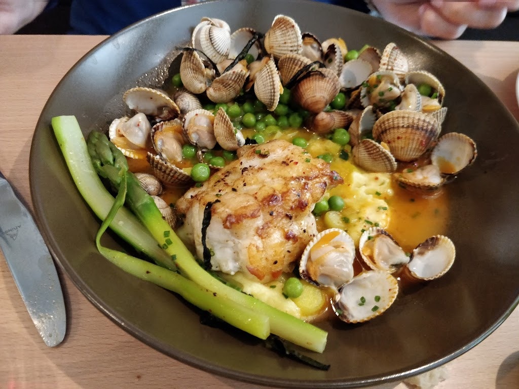 a plate of delicious shells served at Bistro Little Paris