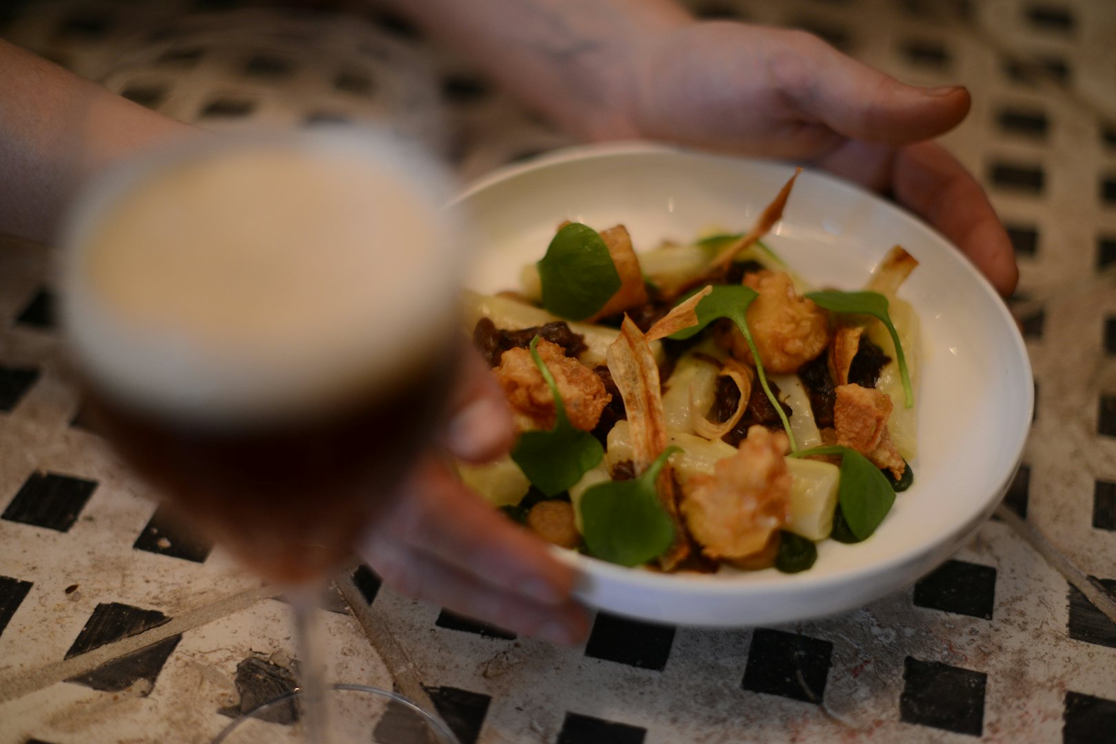 a plate of food and beer at 't Vijfde Seizoen