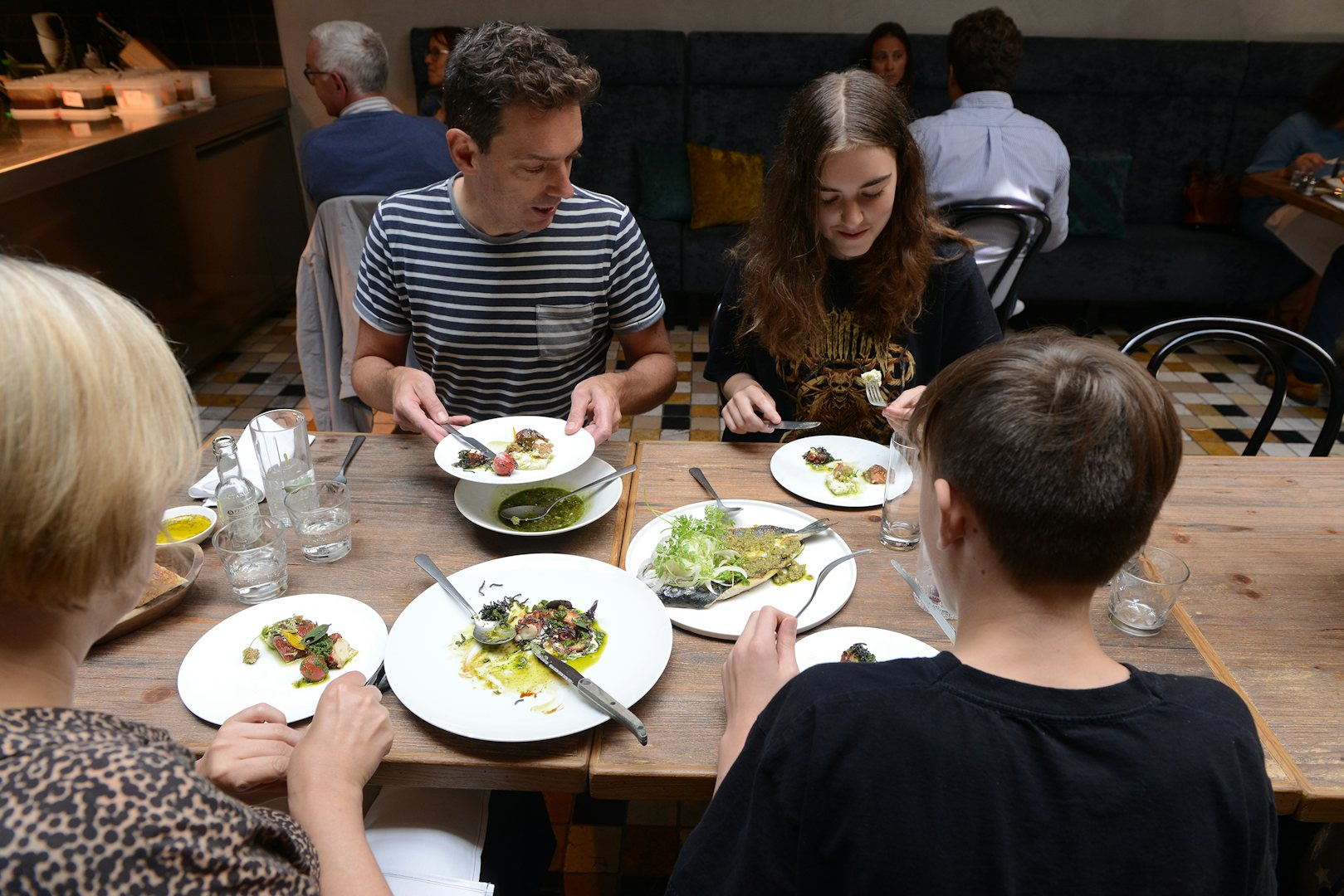 people sharing a dinner at Door73 restaurant in Ghent