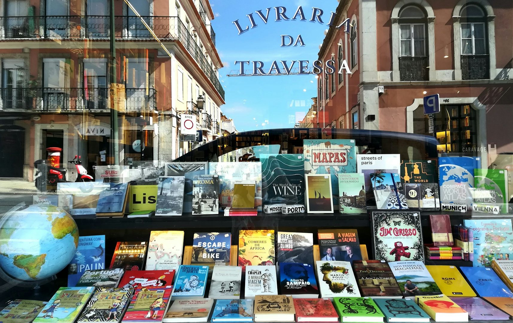 Books on display in the window at Livraria da Travessa