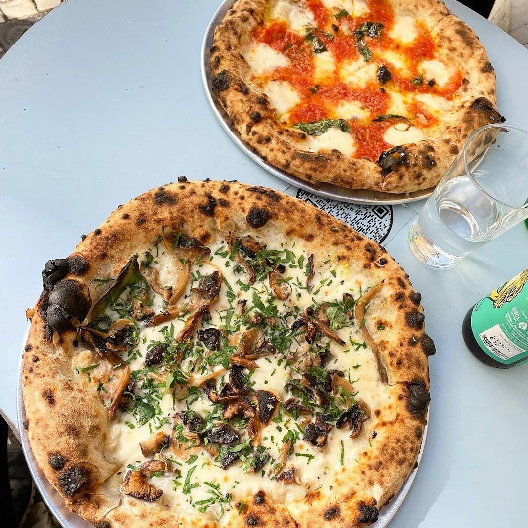 Two pizzas on the table at Lupita Lisbon