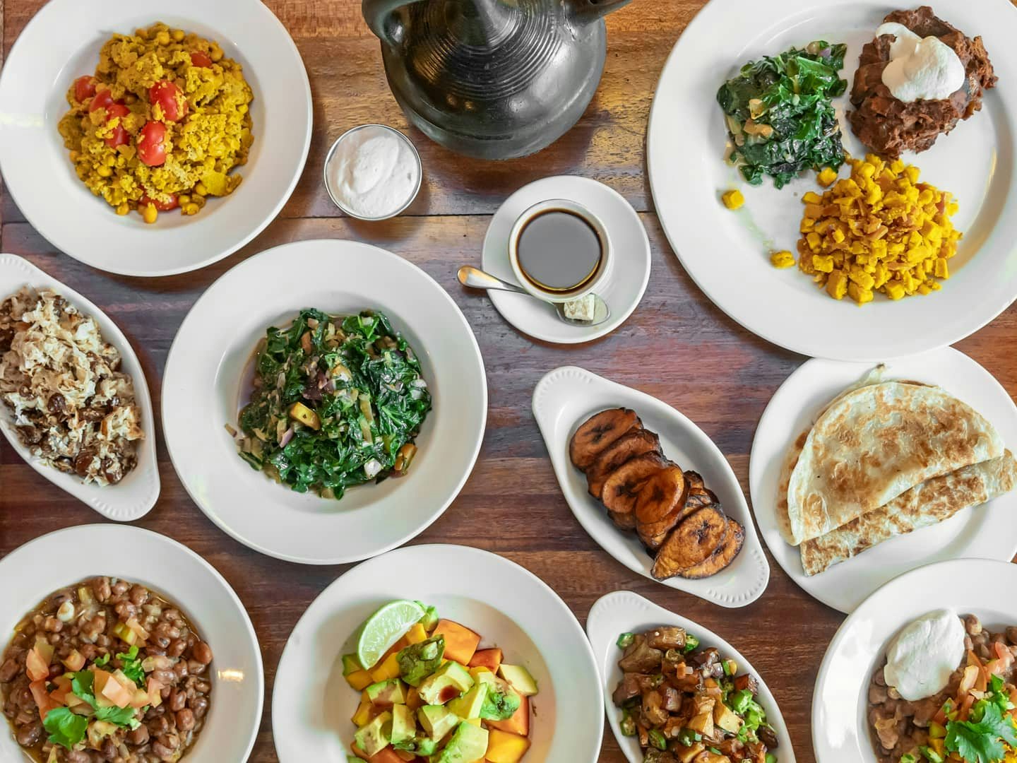 a table full of colourful vegan Ethiopian dishes at Bunna Cafe Brooklyn