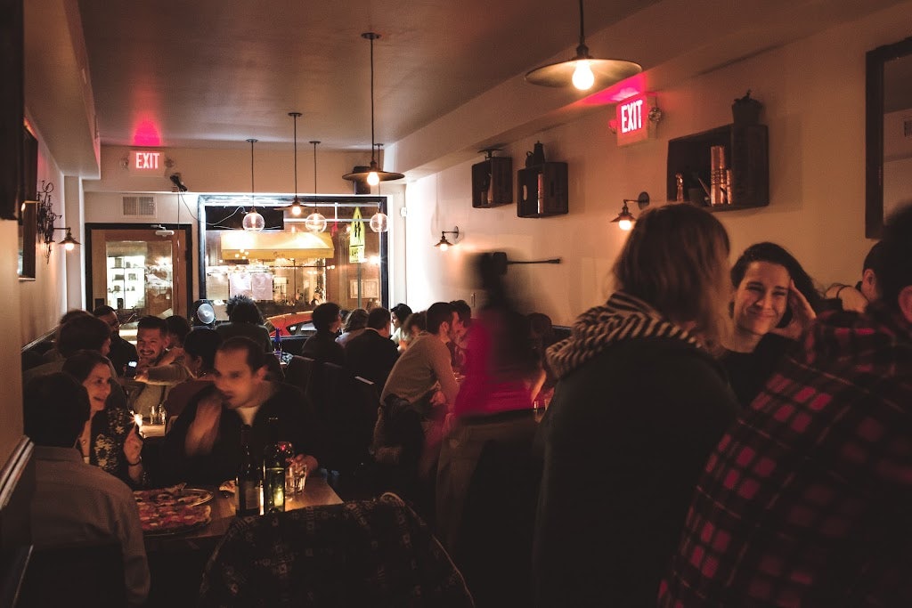 people enjoying dinner at Emily restaurant in Brooklyn