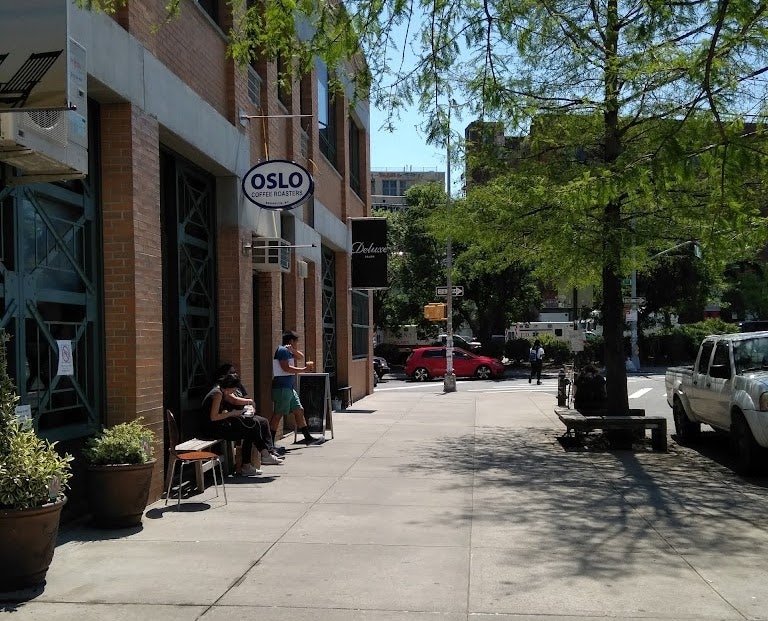 people having coffee outside Oslo Coffee Roasters