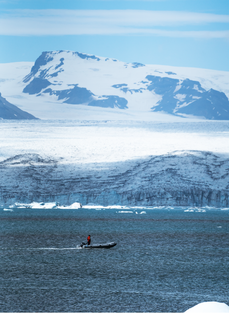 a man in a boat on the Jökulsárlón Lagoon