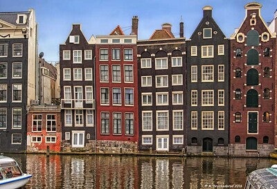 Crooked dancing houses on the canal in Amsterdam