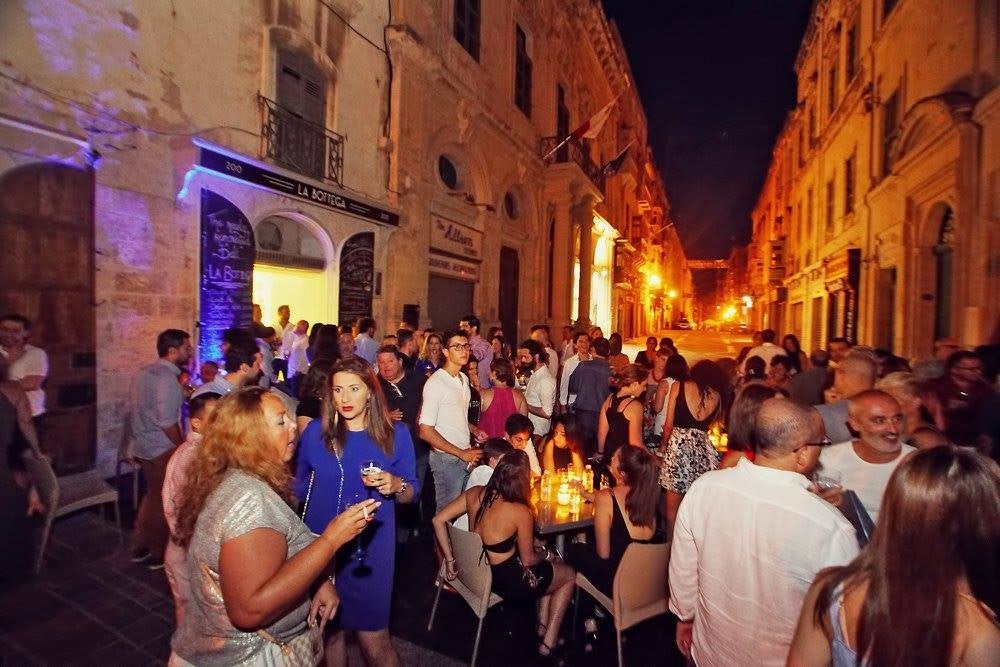 crowd enjoying drinks at La Bottega bar in Valleta