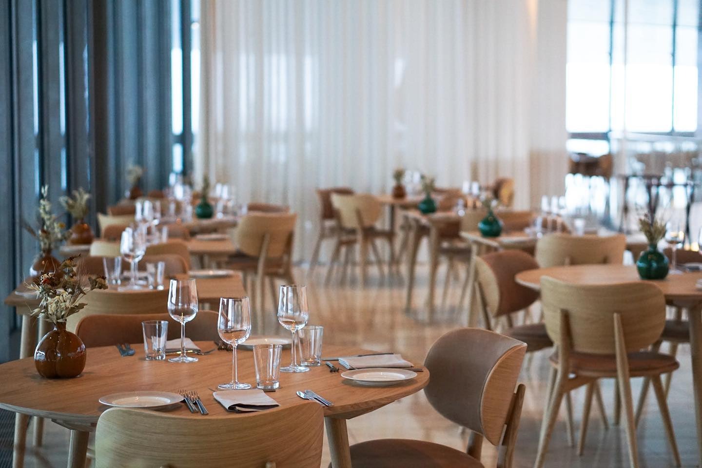 Set tables in the dining area at Almanak I Operaen