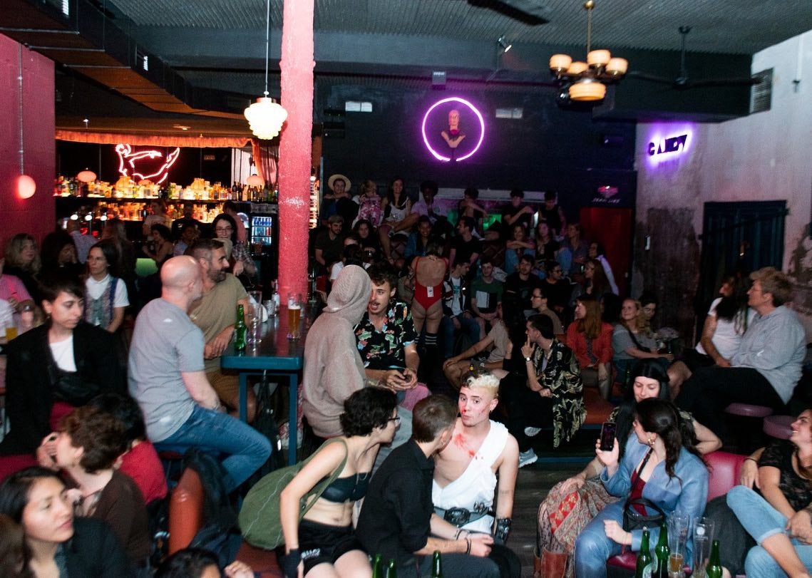 People sitting and drinking inside of Candy Darling Bar
