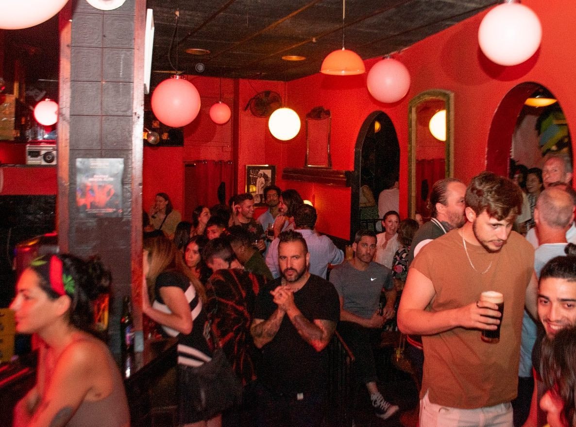 People drinking and talking at Manchester Bar