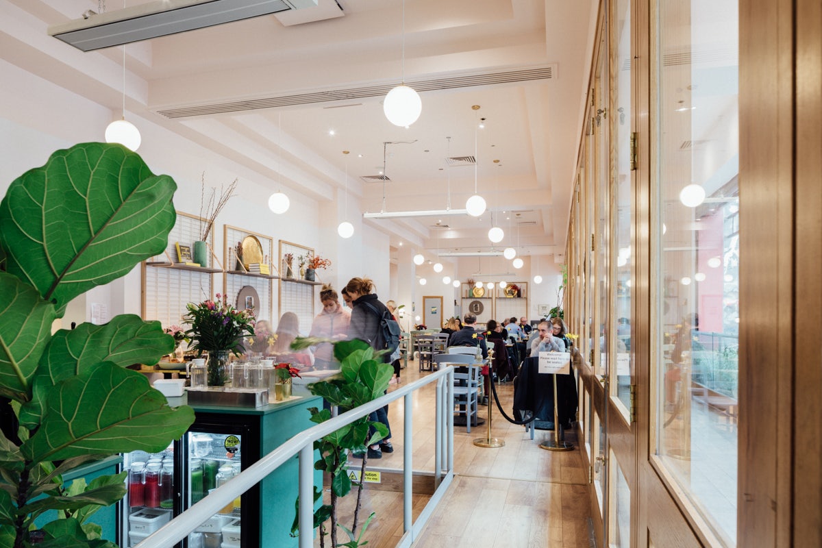 a buzzing crowd inside of the cafe Brother Hubbard