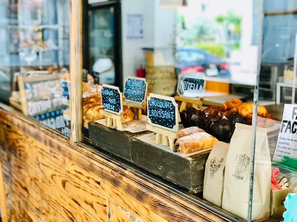 cakes and sweets displayed ad Cachito Coffee and Bakery 