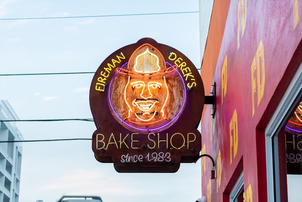 neon sign of Fireman Derek's Bake Shop and Cafe