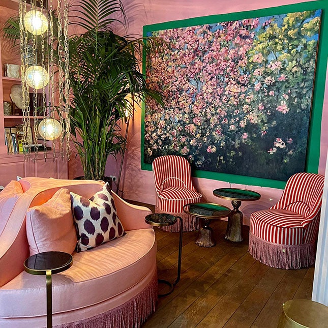 Pink interior with floral painting at Hotel Flora