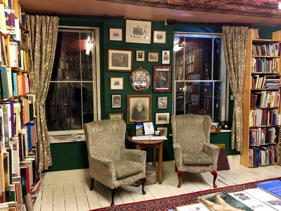 Interior with bookcases and armchairs at Scarthin Books